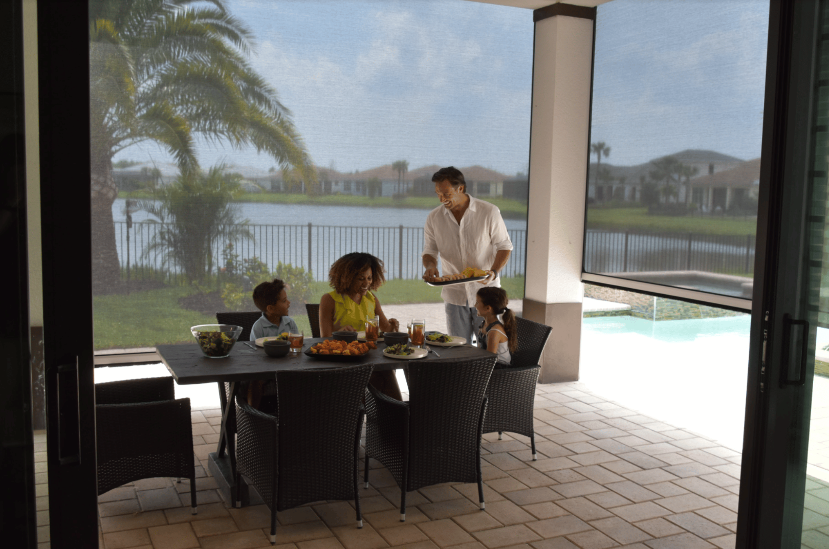 Patio screen enclosing an outdoor dining area
